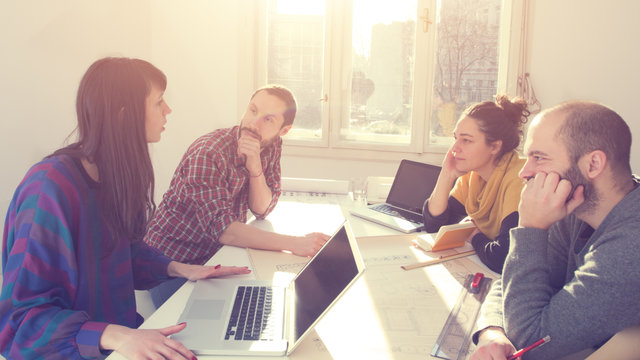 Group of people discussing business plans