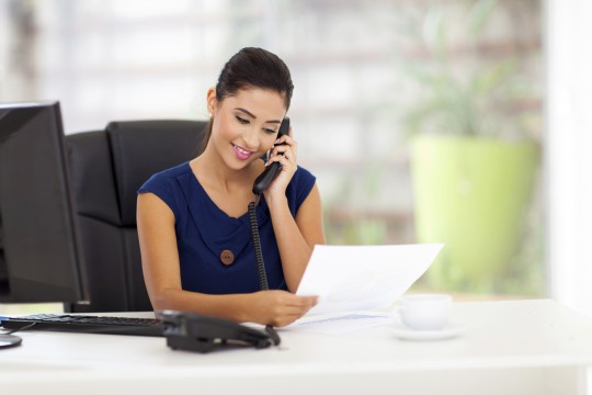 Girl talking in phone at office