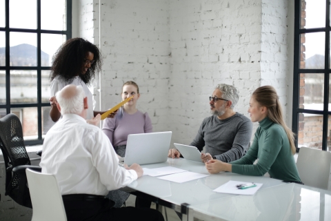 Woman presenting to team